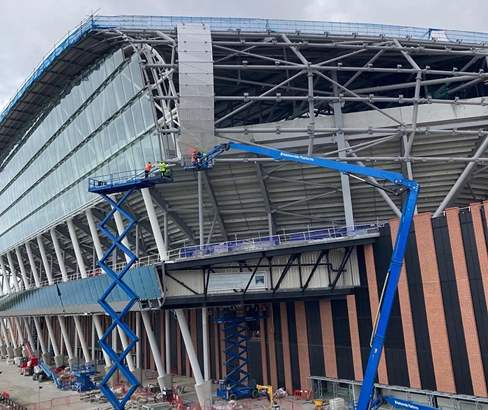 The east stand cladding being placed by cranes